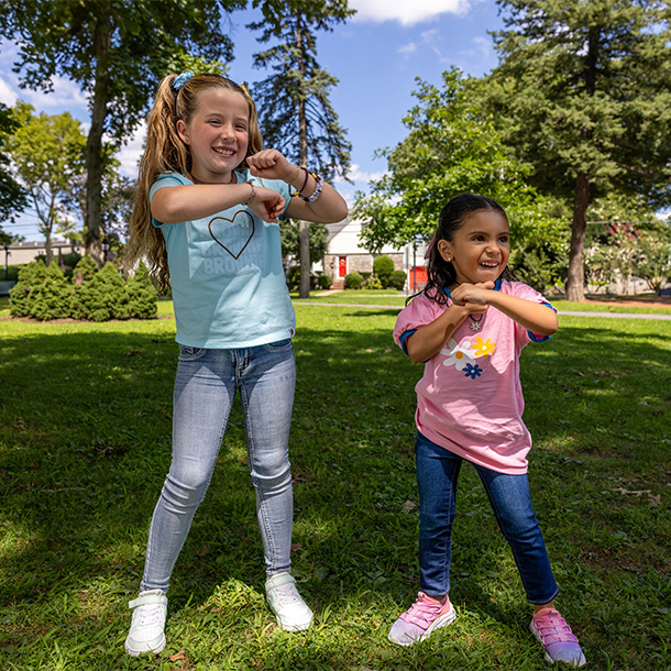 a Daisy and Brownie dancing outside